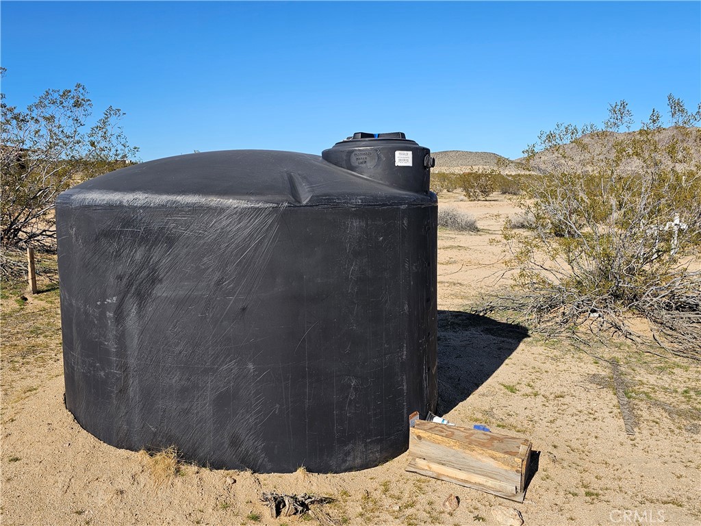 0 Shawnee Landers, CA 92285 - Photo 6 of 7 a bed sitting in a bedroom next to a wall