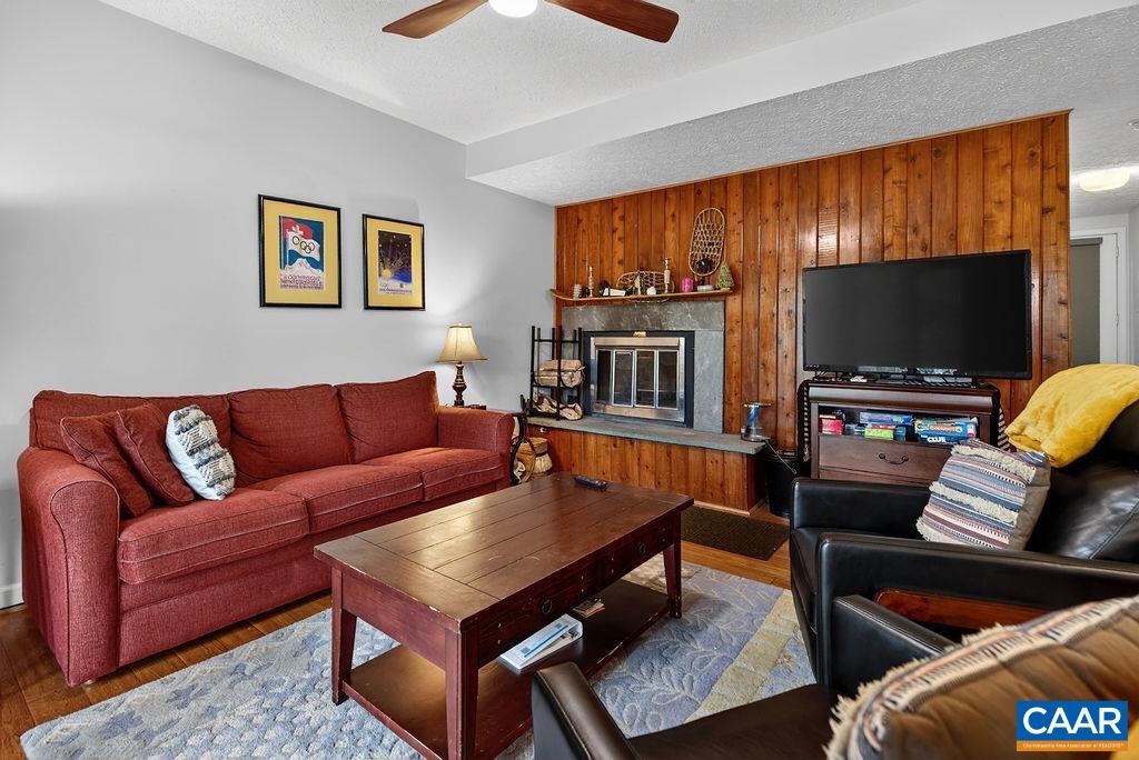 410 Three Ridges Roseland, VA 22967 - Photo 14 of 21 a living room with furniture and a flat screen tv