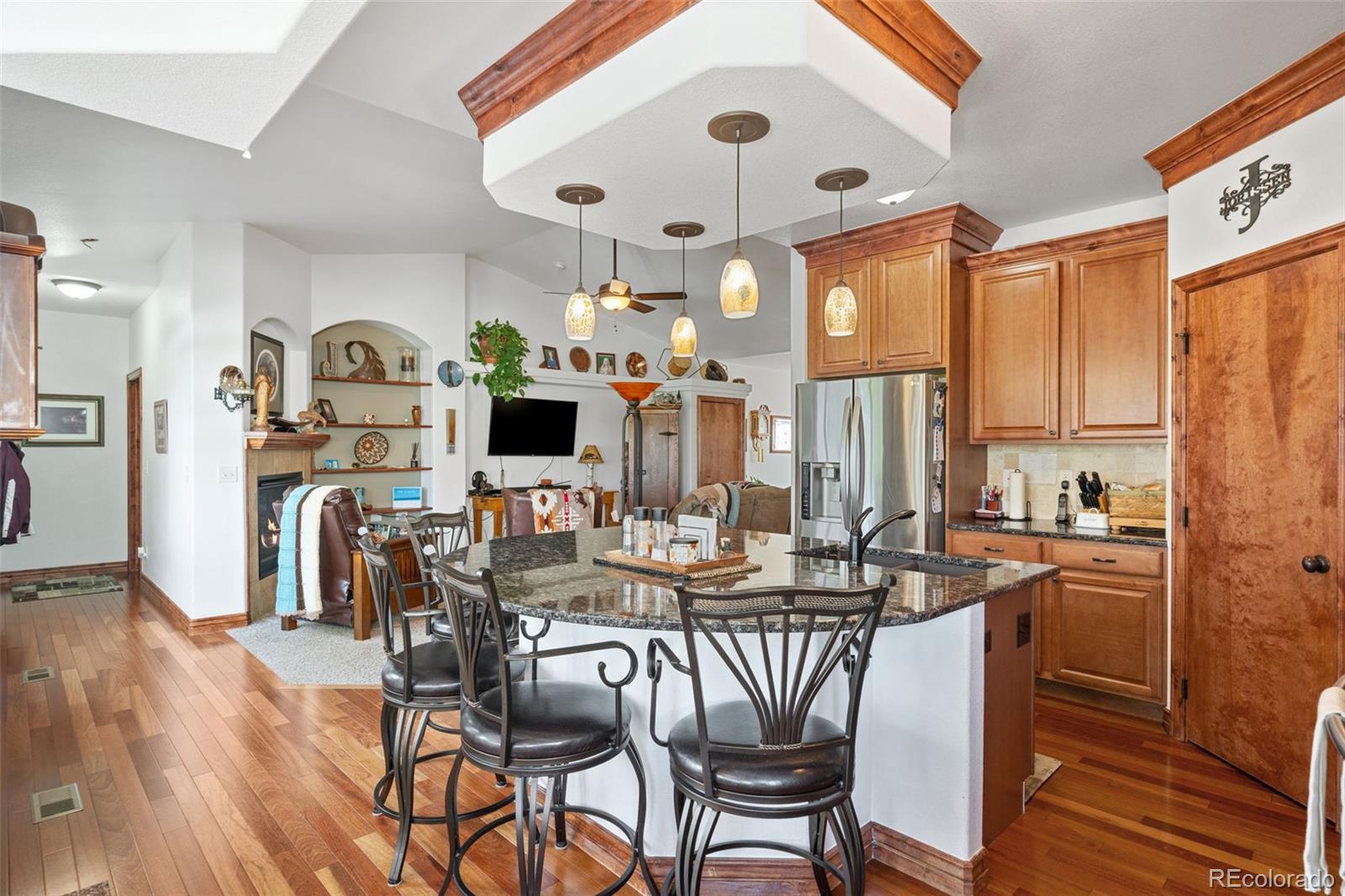1731 Wales Drive Berthoud, CO 80513 - Photo 11 of 36 a view of a dining room with furniture and wooden floor