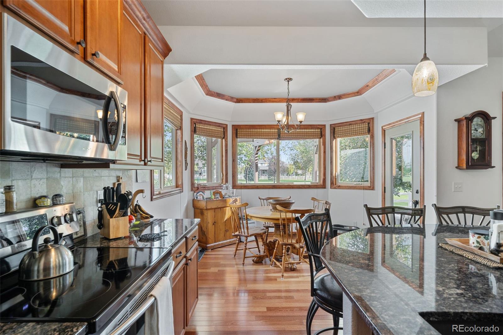 1731 Wales Drive Berthoud, CO 80513 - Photo 12 of 36 a view of a dining room with furniture window and outside view