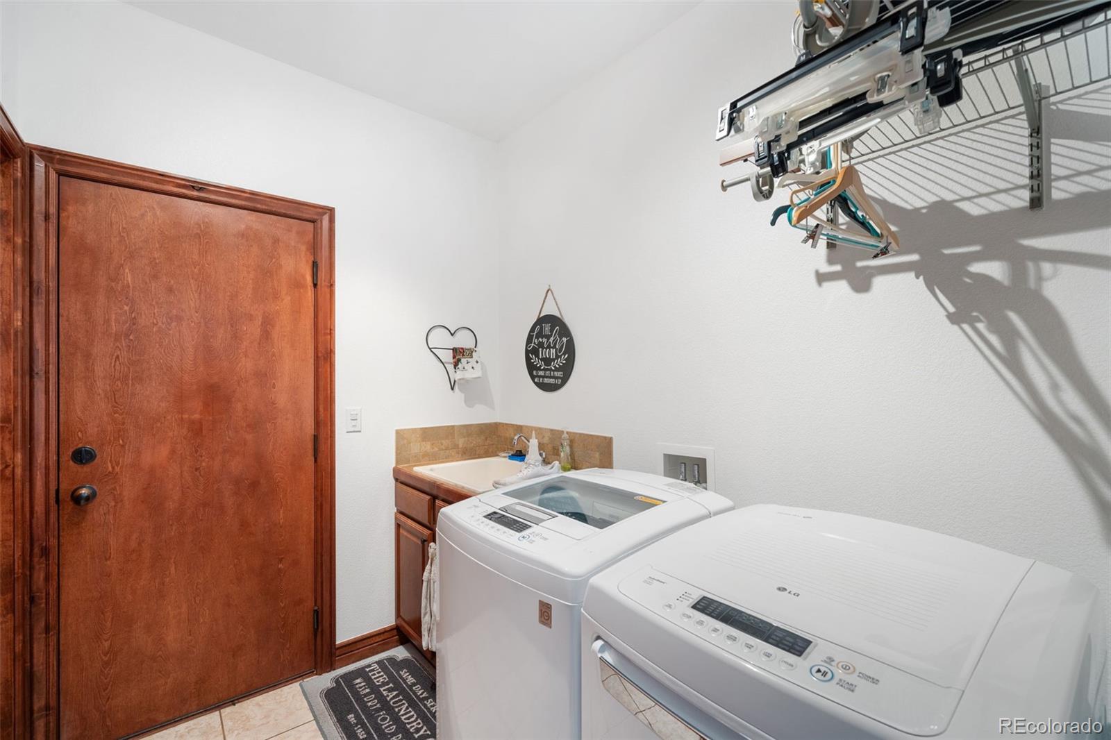 1731 Wales Drive Berthoud, CO 80513 - Photo 20 of 36 a utility room with dryer and washer