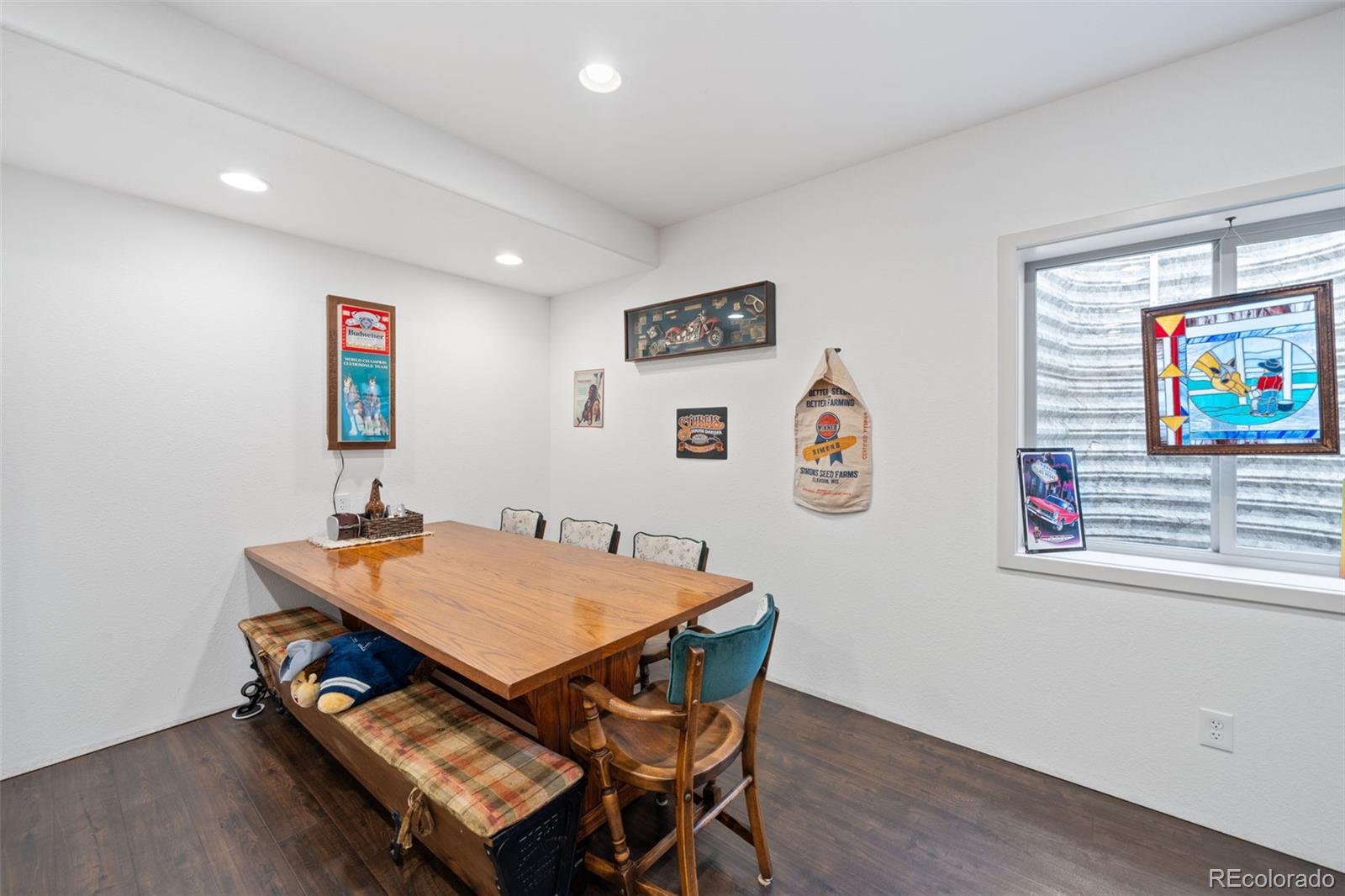 1731 Wales Drive Berthoud, CO 80513 - Photo 25 of 36 a view of a dining room with furniture and wooden floor