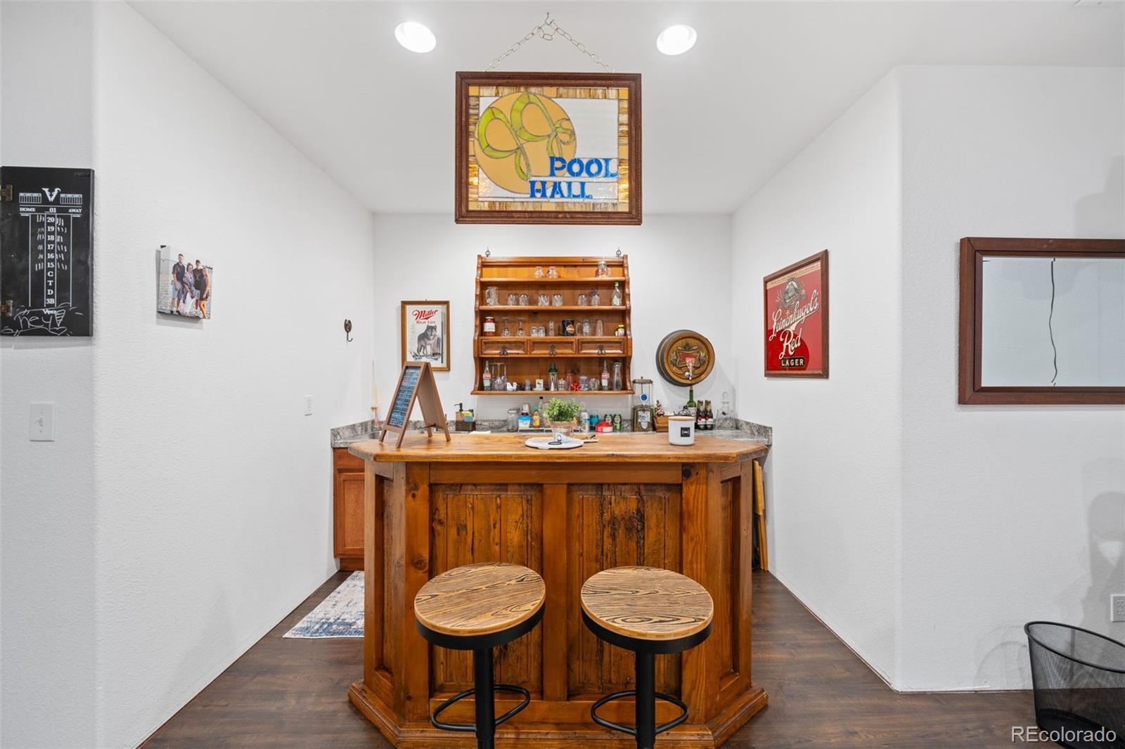 1731 Wales Drive Berthoud, CO 80513 - Photo 26 of 36 a view of a dinning room with furniture and wooden floor