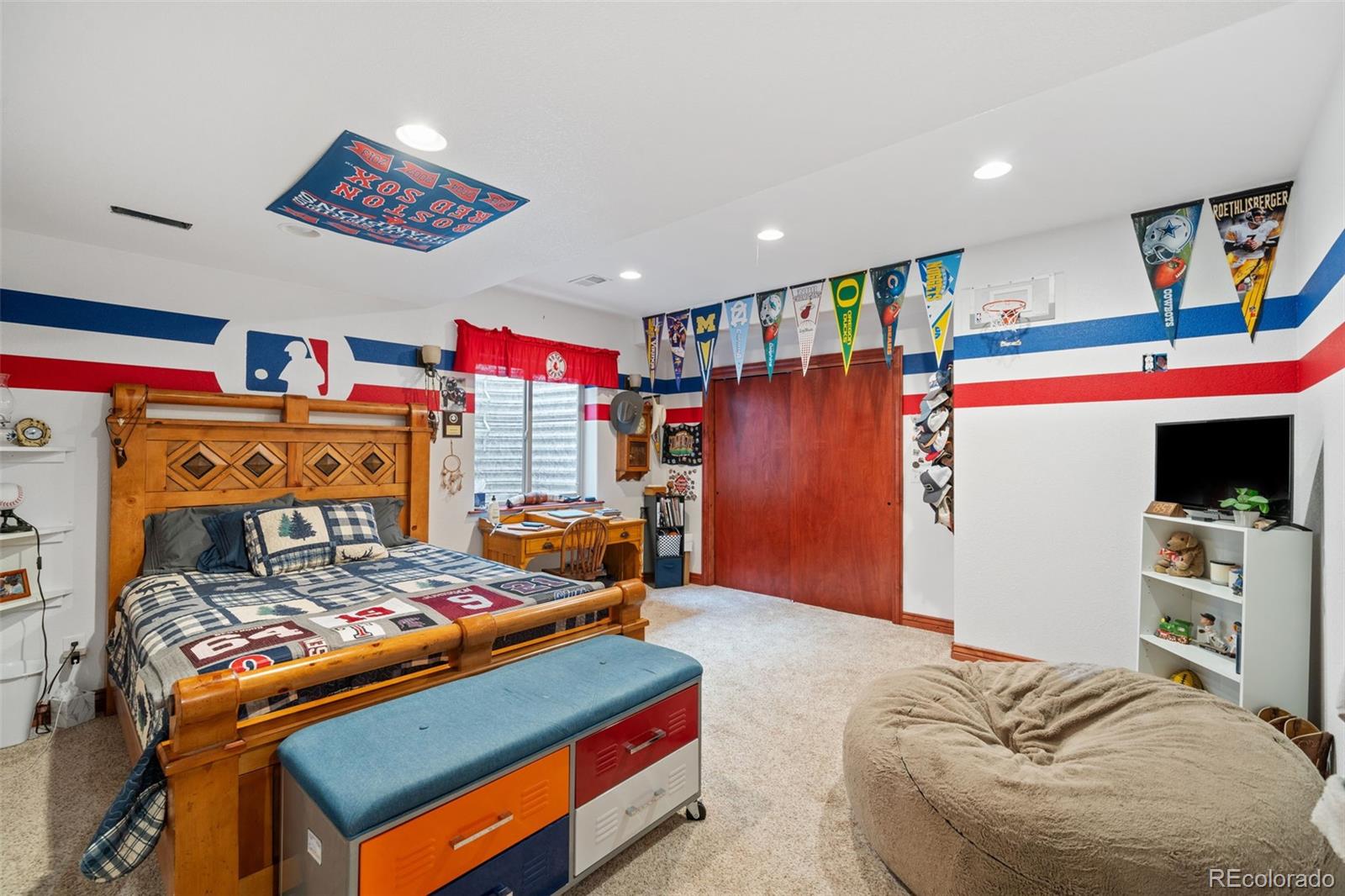 1731 Wales Drive Berthoud, CO 80513 - Photo 27 of 36 a bed room with a bed and a couch