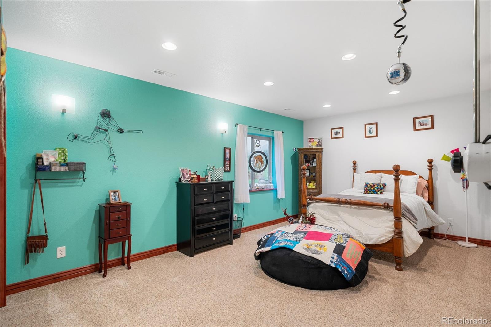 1731 Wales Drive Berthoud, CO 80513 - Photo 28 of 36 a bedroom with furniture and a gym equipment