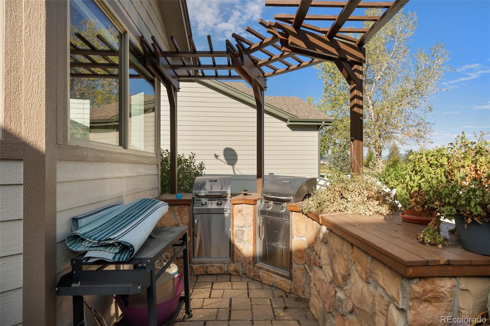1731 Wales Drive Berthoud, CO 80513 - Photo 32 of 36 a view of a patio with chair and tables