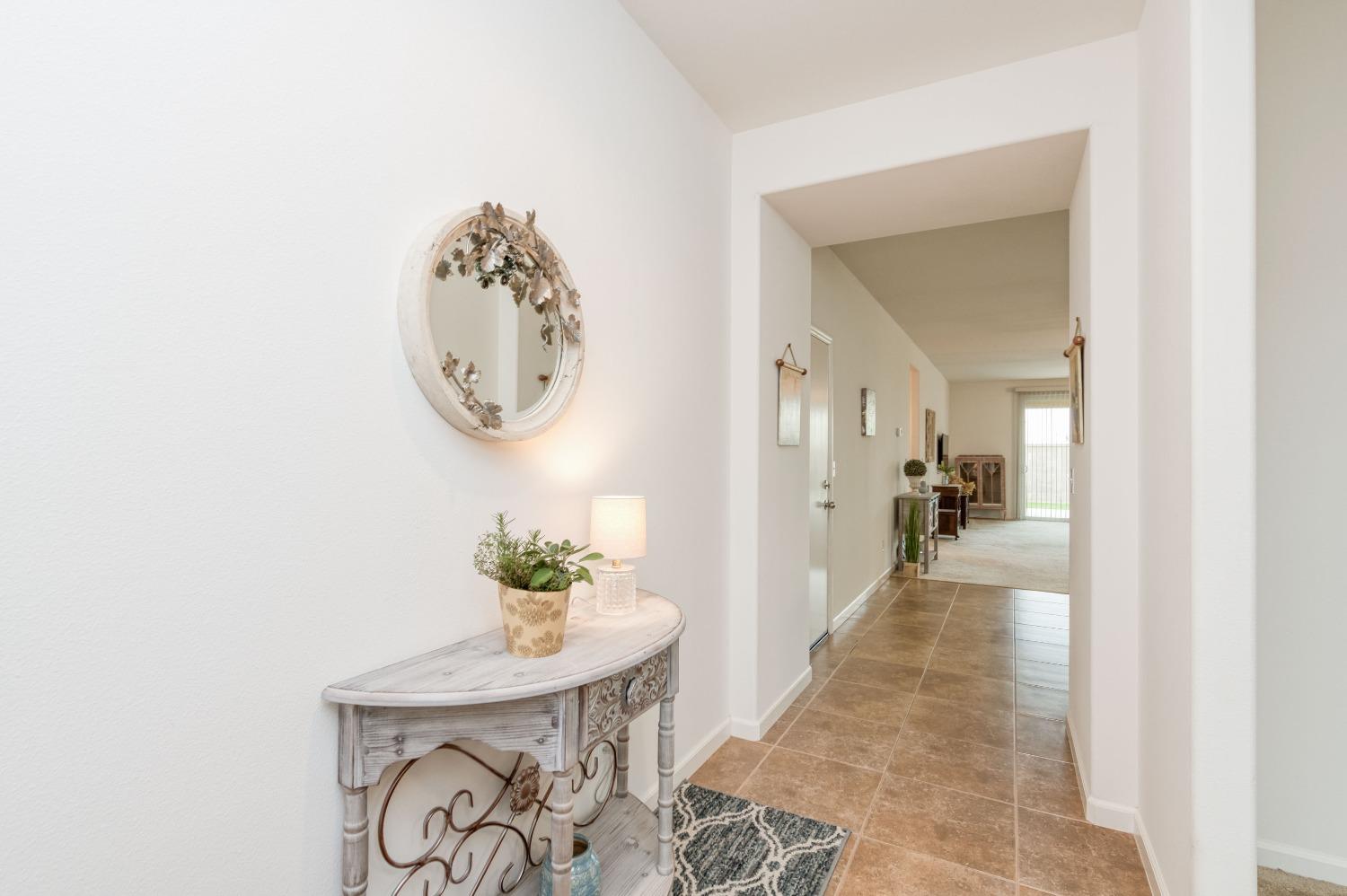 3994 Chessa Lane Clovis, CA 93619 - Photo 2 of 36 a view of a hallway to a livingroom with furniture