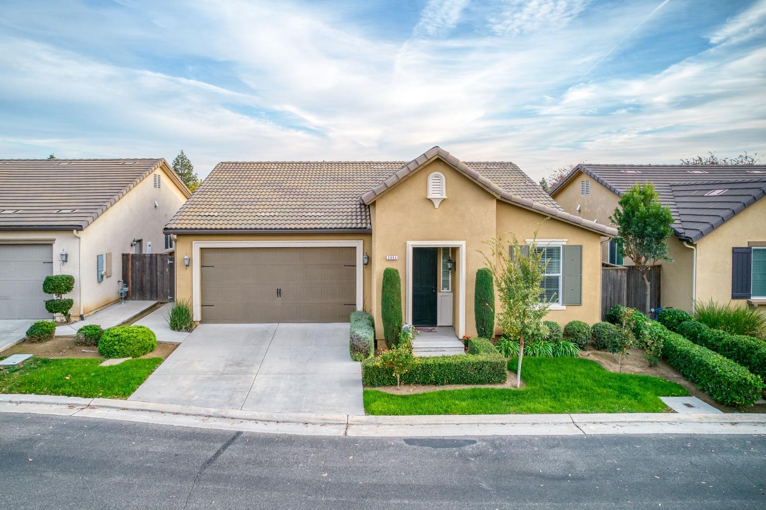 3994 Chessa Lane Clovis, CA 93619 - Photo 27 of 36 a front view of house with yard and green space