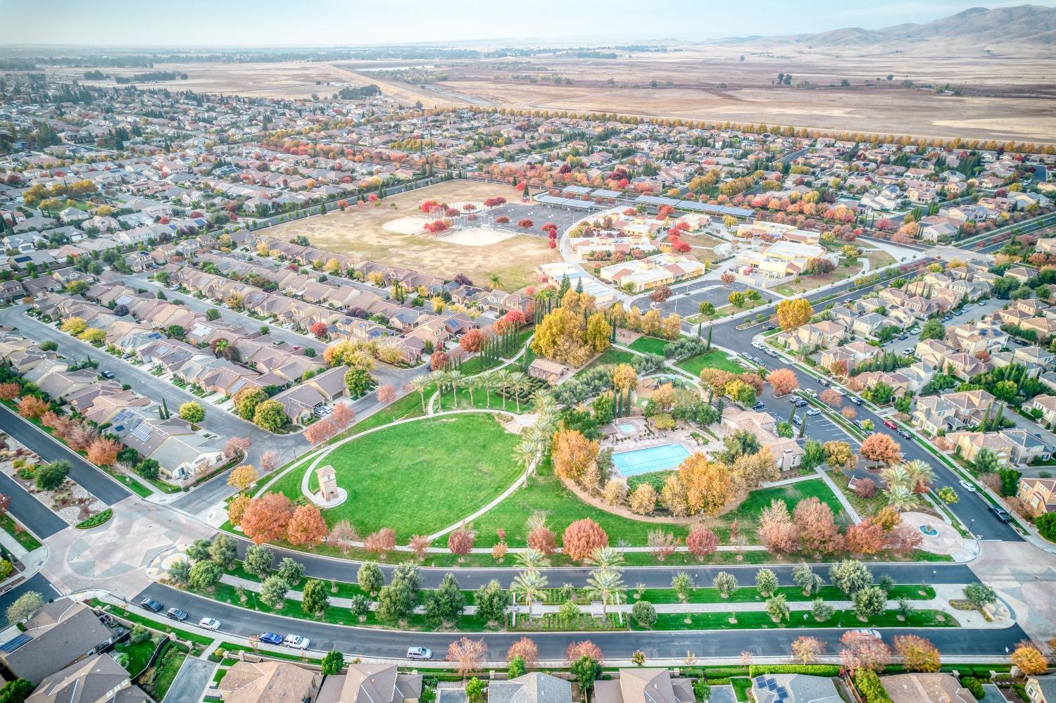 3994 Chessa Lane Clovis, CA 93619 - Photo 35 of 36 an aerial view of residential houses with outdoor space and trees