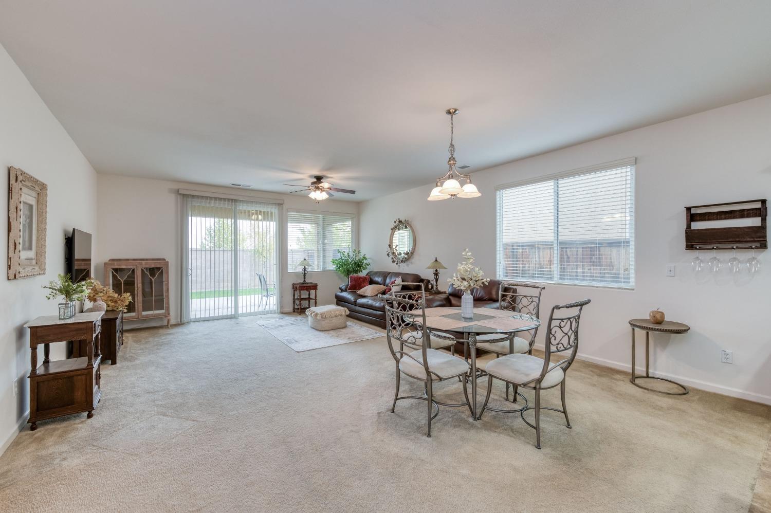 3994 Chessa Lane Clovis, CA 93619 - Photo 9 of 36 a view of a dining room with furniture window and outside view