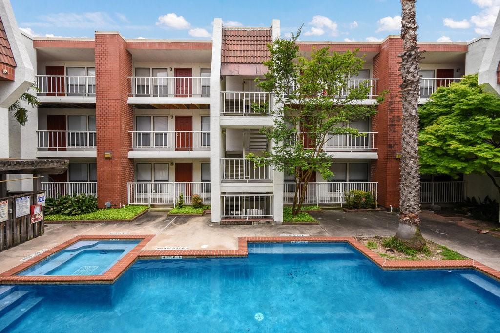 a view of pool with outdoor seating