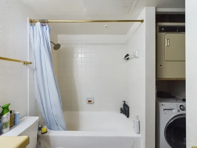 a bathroom with a bathtub a sink and a toilet
