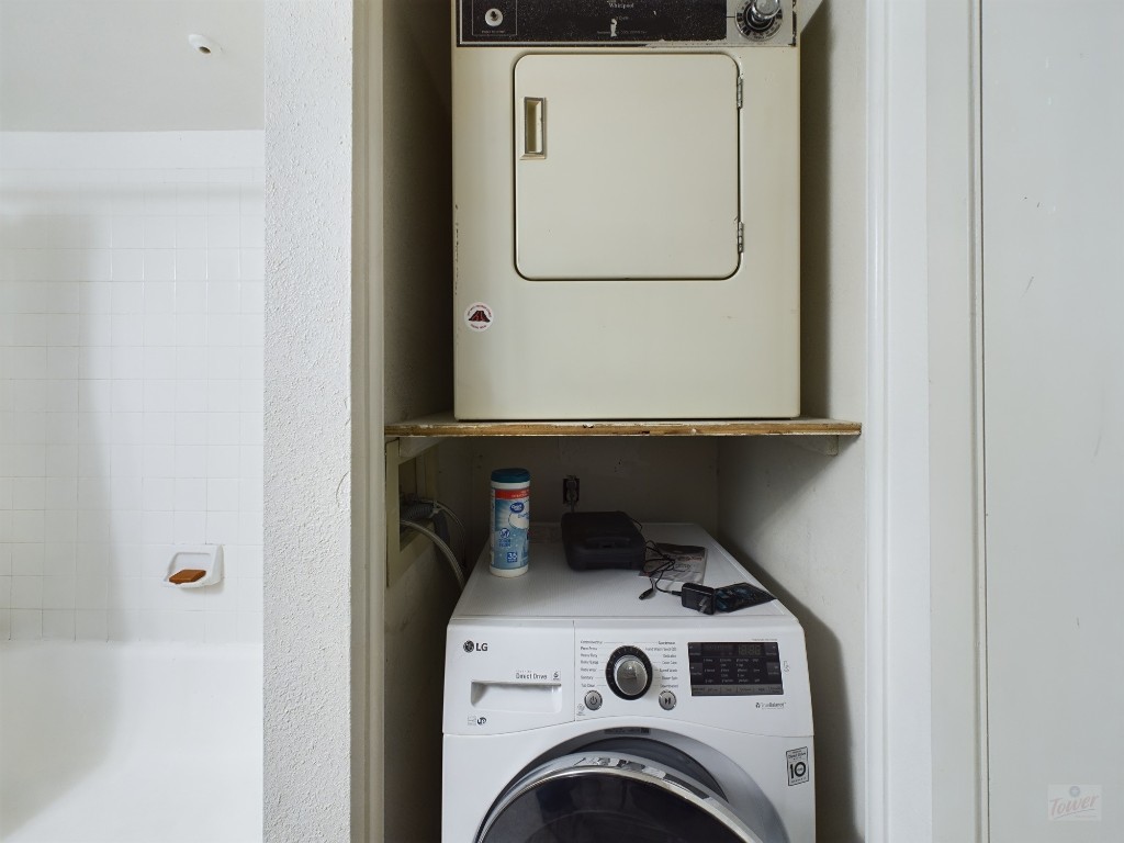 3115 Helms Street, Unit 301 Austin, TX 78705 - Photo 9 of 19 a utility room with dryer and washer