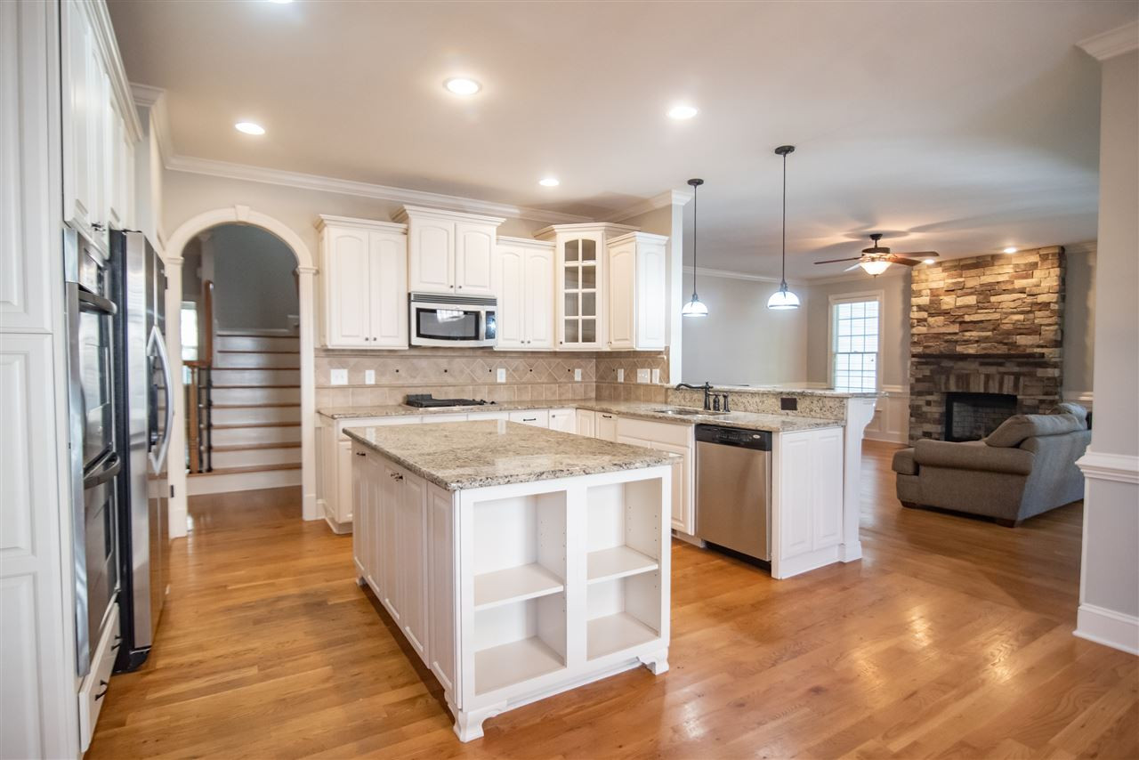 3736 Falls River Avenue Raleigh, NC 27614 - Photo 13 of 30 Stainless steel appliances, granite countertops and a huge island creates the perfect setting for cooking gourmet meals. Kitchen