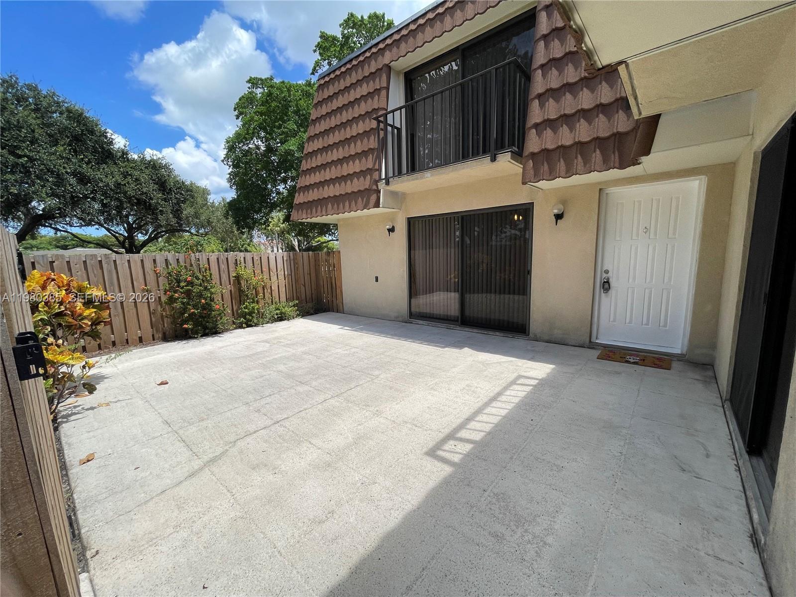 237 Charter Way, Unit 237 West Palm Beach, FL 33407 - Photo 18 of 18 a view of a house with a garage