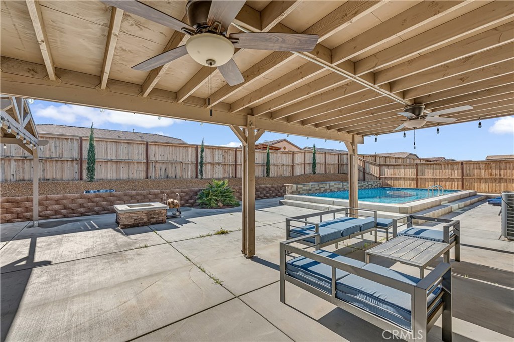 11409 Bellevue Street Adelanto, CA 92301 - Photo 20 of 49 a view of a patio with a table and chairs