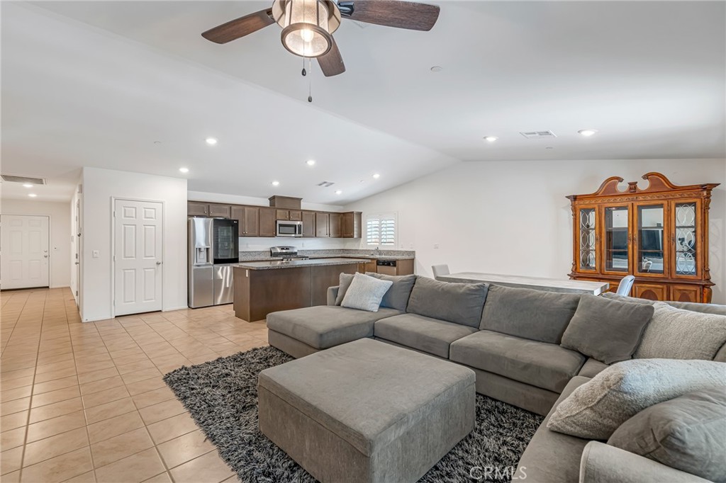 11409 Bellevue Street Adelanto, CA 92301 - Photo 26 of 49 a living room with furniture and kitchen view