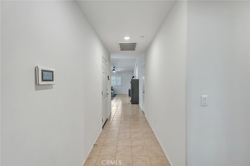 11409 Bellevue Street Adelanto, CA 92301 - Photo 34 of 49 a view of a hallway with a white walls
