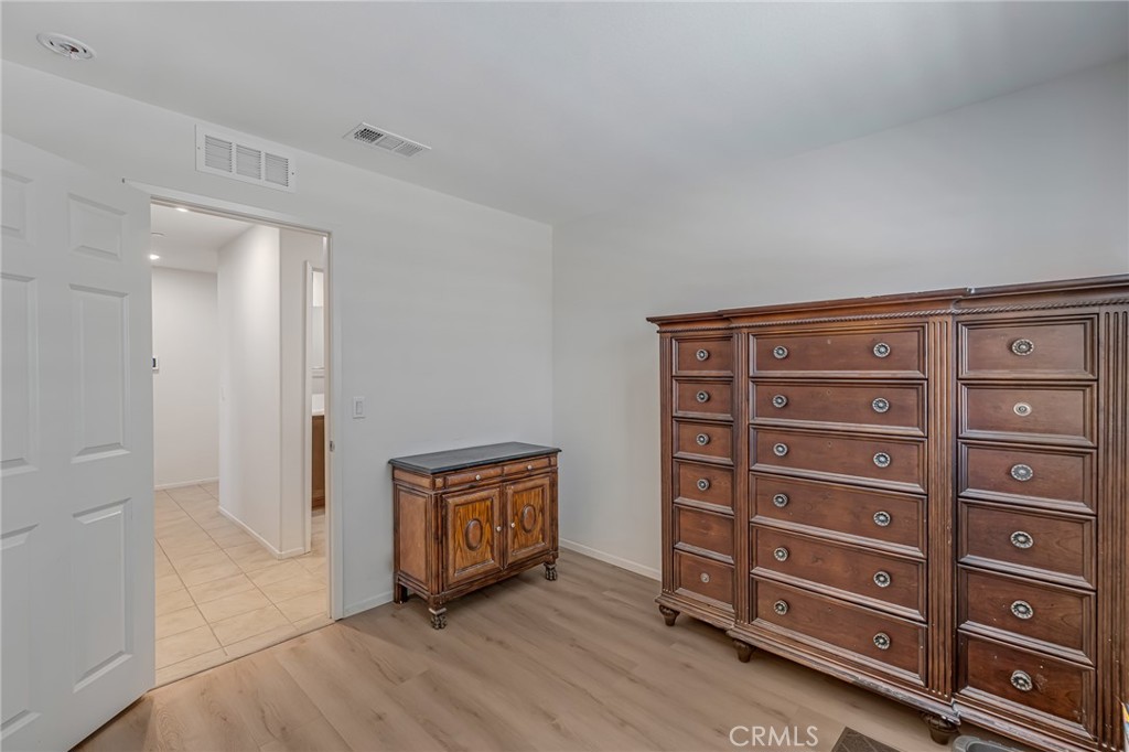 11409 Bellevue Street Adelanto, CA 92301 - Photo 35 of 49 a view of an empty room with a fireplace