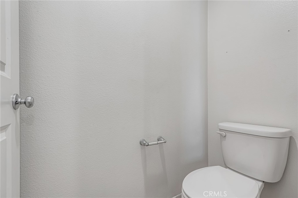 11409 Bellevue Street Adelanto, CA 92301 - Photo 39 of 49 a white toilet sitting next to a shower