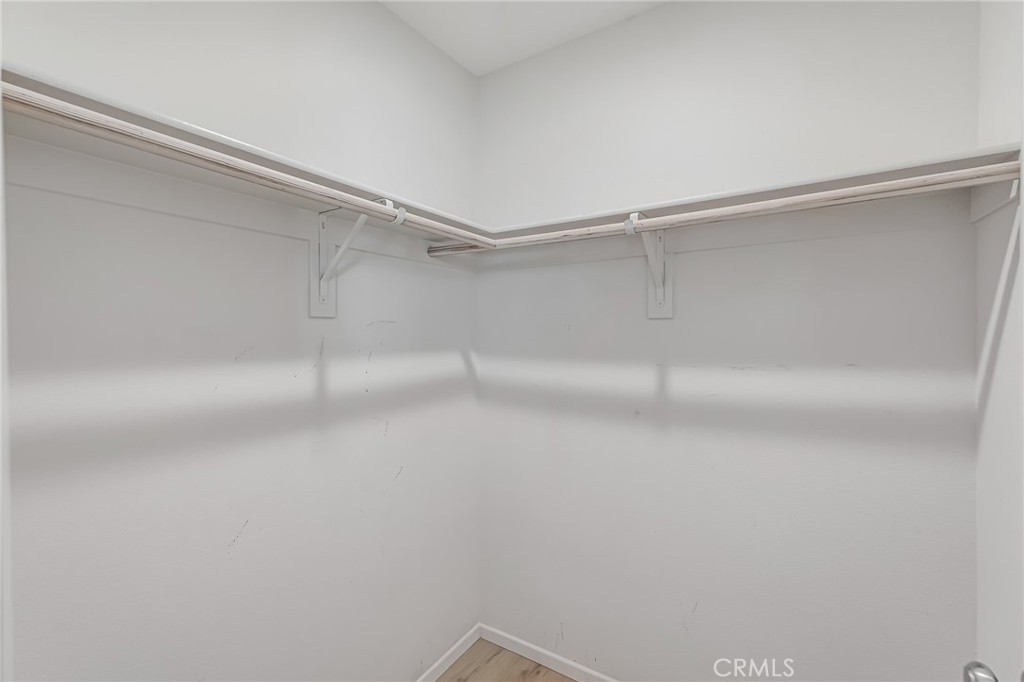 11409 Bellevue Street Adelanto, CA 92301 - Photo 41 of 49 a view of a room with shelf on the wall