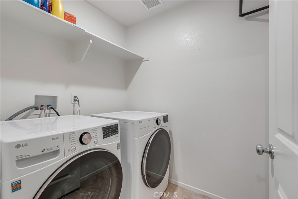 11409 Bellevue Street Adelanto, CA 92301 - Photo 49 of 49 a utility room with dryer and washer