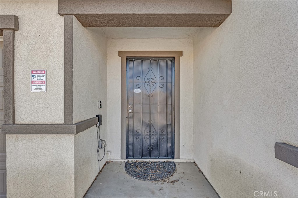 11409 Bellevue Street Adelanto, CA 92301 - Photo 5 of 49 a view of a door and an empty room