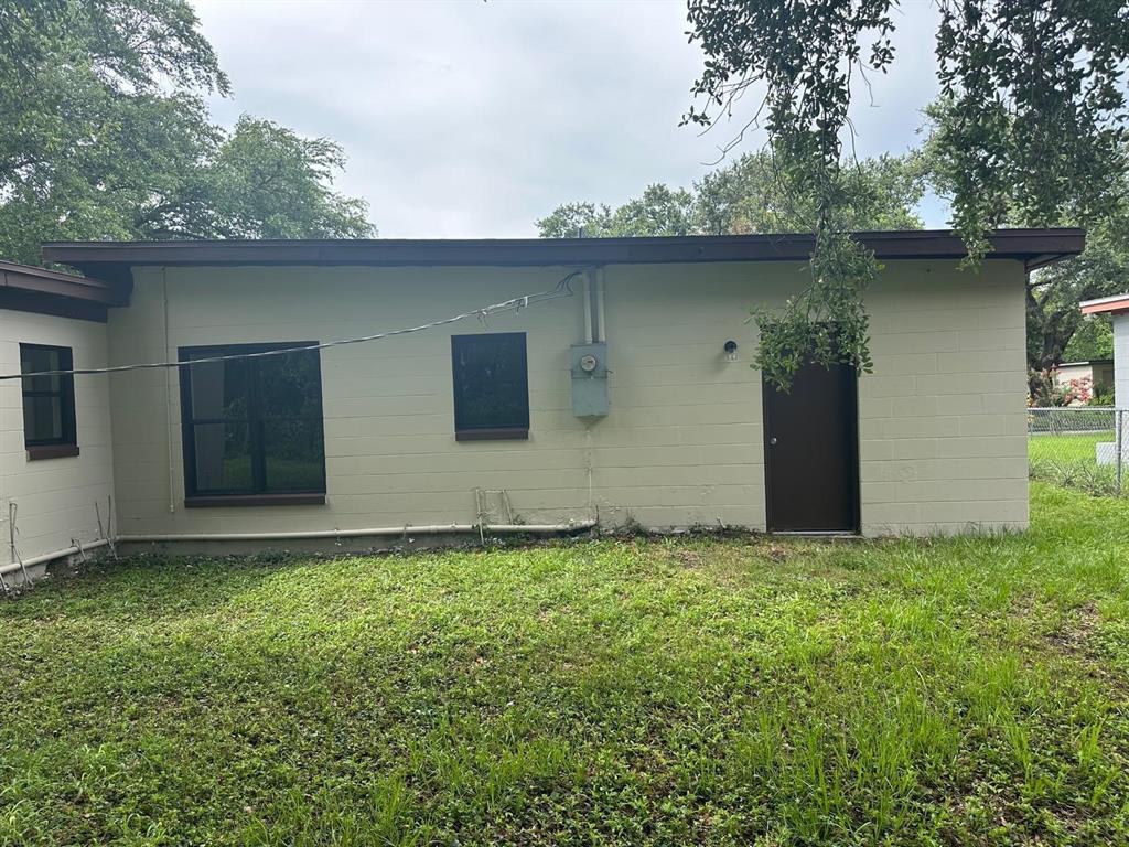 4514 Arch Street Orlando, FL 32808 - Photo 17 of 21 a backyard of a house with lots of green space