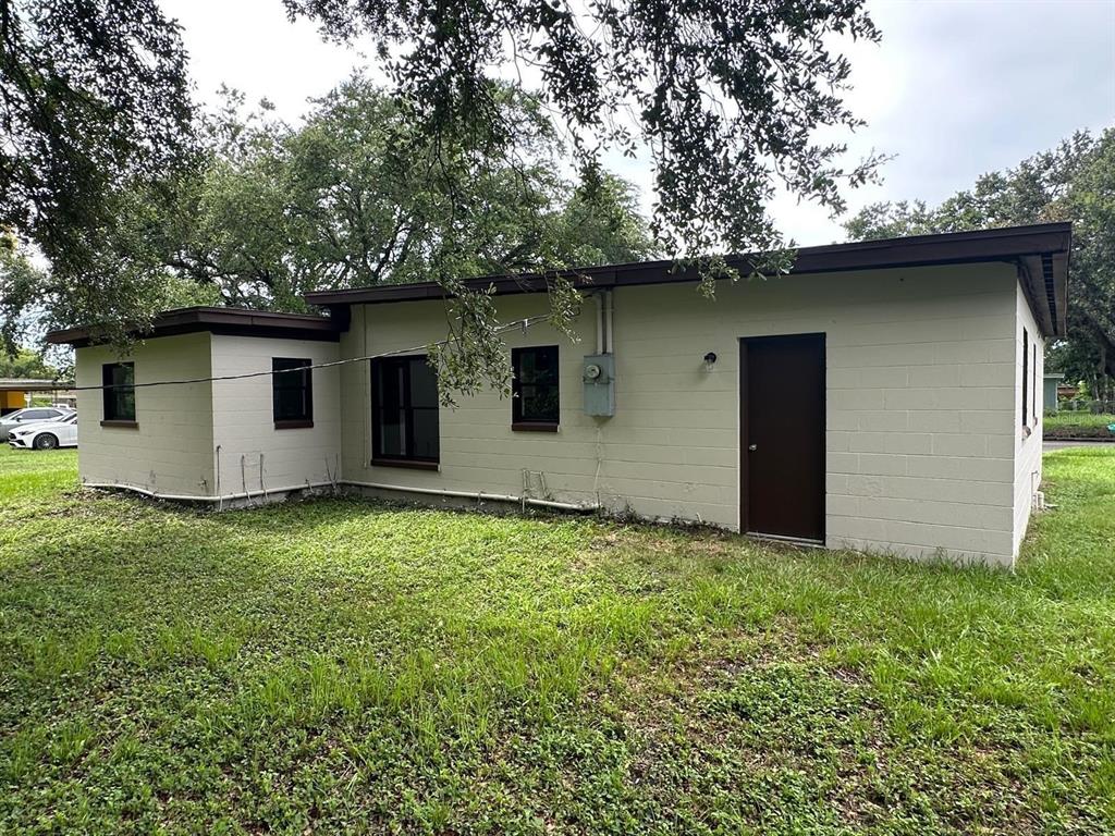 4514 Arch Street Orlando, FL 32808 - Photo 18 of 21 a backyard of a house with garage