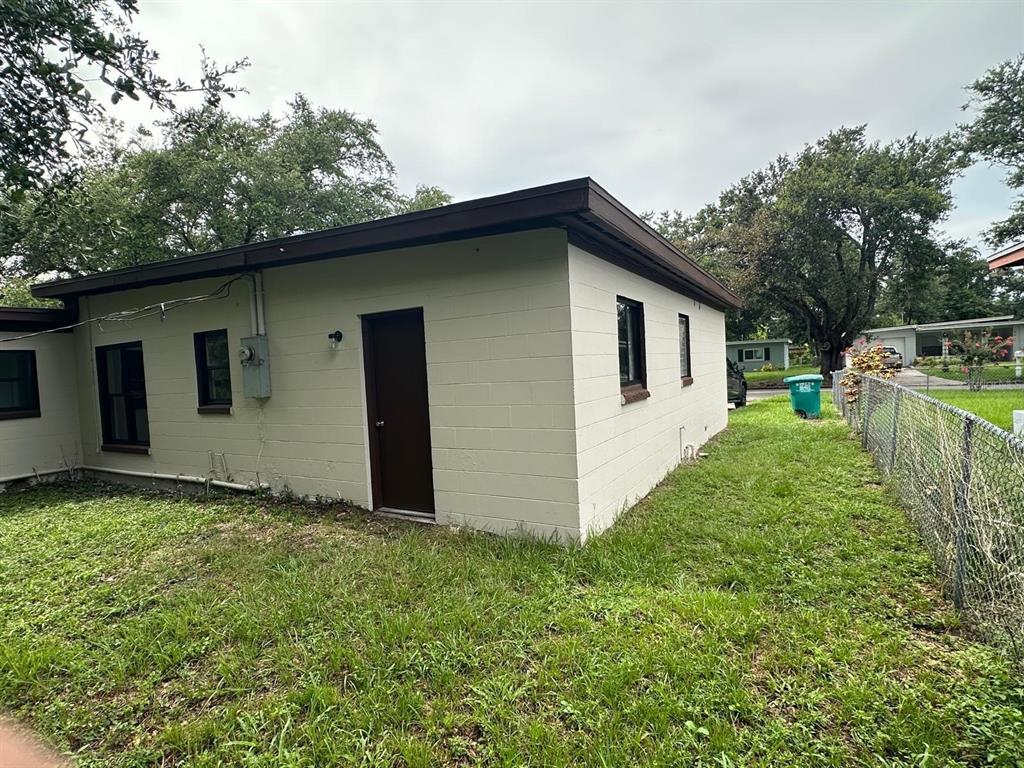 4514 Arch Street Orlando, FL 32808 - Photo 19 of 21 a view of a house with a yard