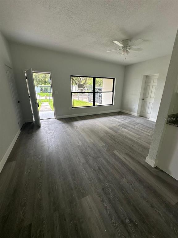 4514 Arch Street Orlando, FL 32808 - Photo 2 of 21 wooden floor in an empty room with a window