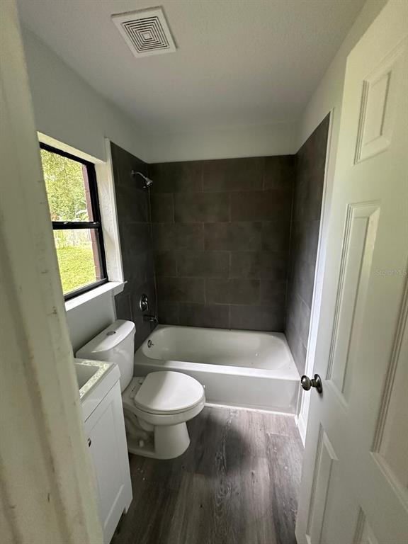 4514 Arch Street Orlando, FL 32808 - Photo 9 of 21 a bathroom with a sink a toilet and a bathtub