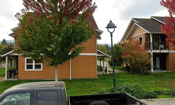 a front view of a house with a yard