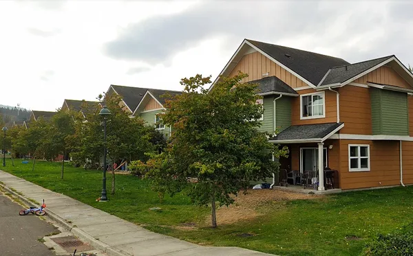 a front view of a house with a yard