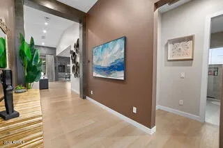 a view of an entryway with wooden floor