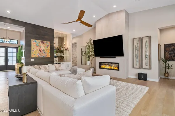 a living room with furniture and a flat screen tv