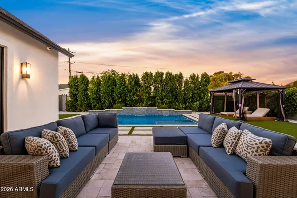 a view of a balcony with floor to ceiling windows