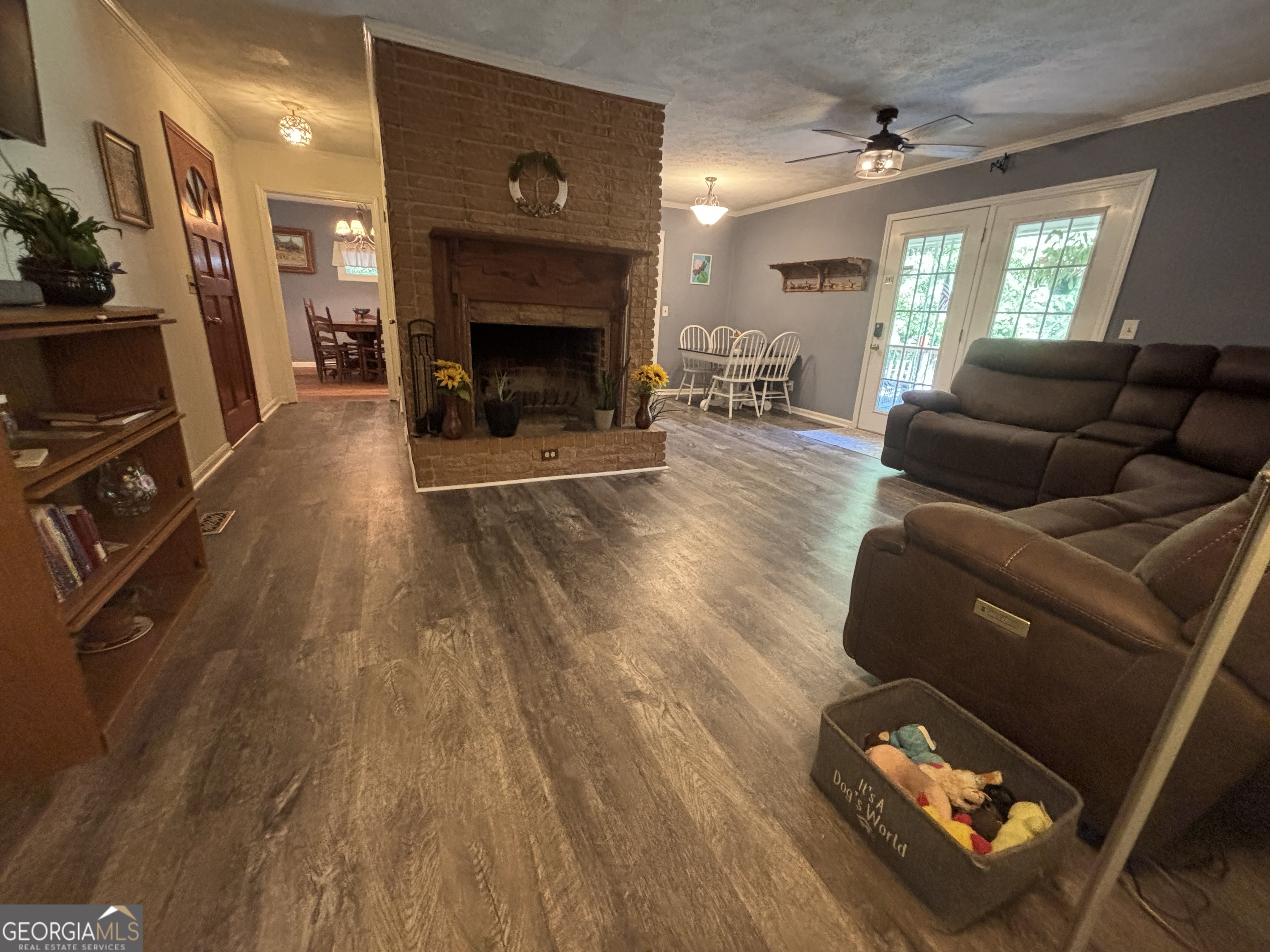 152 Crest Drive Cochran, GA 31014 - Photo 16 of 54 a living room with furniture and a fireplace