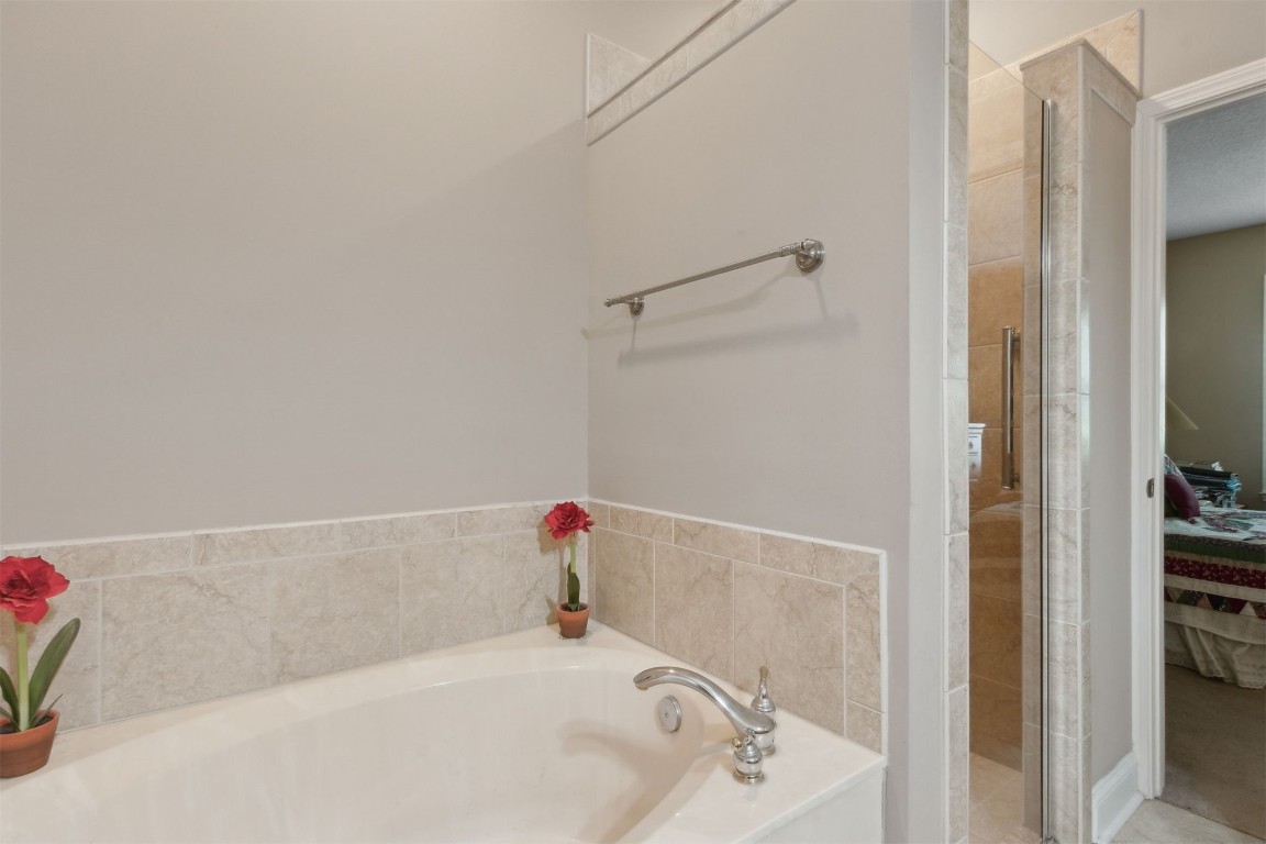 1827 Perimeter Park Road West Fernandina Beach, FL 32034 - Photo 17 of 28 Primary Bathroom with separate soaking tub and tiled shower