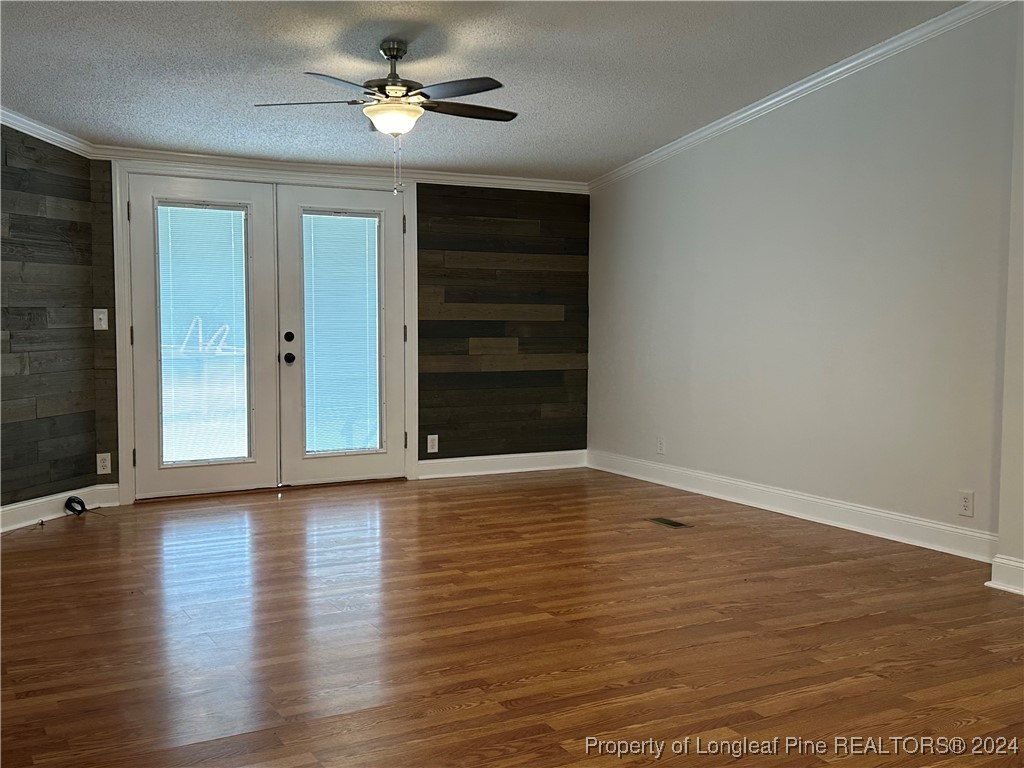 459 Nye Road Orrum, NC 28369 - Photo 17 of 25 a view of room with hardwood floor and ceiling fan