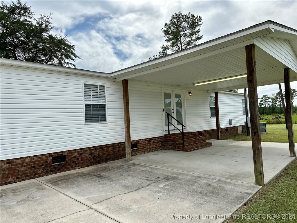 459 Nye Road Orrum, NC 28369 - Photo 4 of 25 a view of a house with backyard