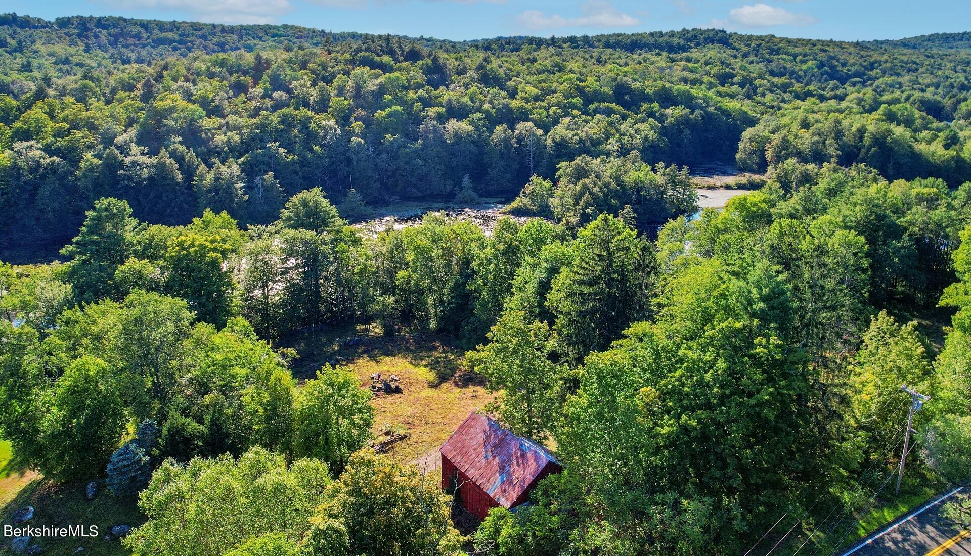 Lot 9 North Main Road Otis, MA 01253 - Photo 3 of 11 an aerial view of a house with a yard and large trees
