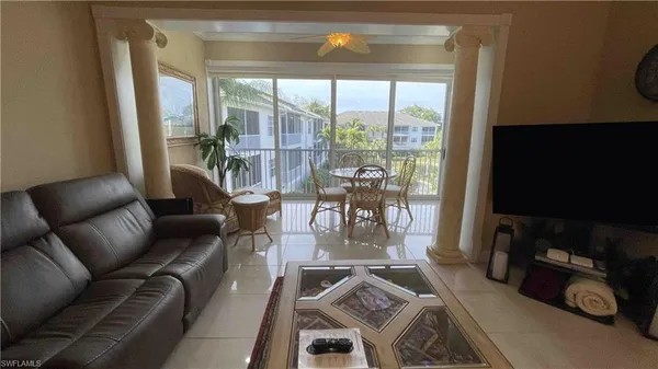a view of a livingroom with furniture and a flat screen tv