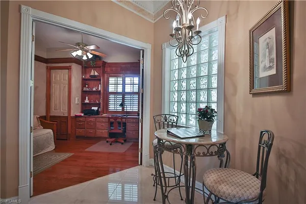 a dining room with furniture and window
