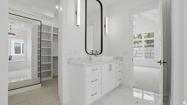 1682 North 1950 W Street, Unit 9 Provo, UT 84604 - Photo 34 of 84 Contemporary vanity featuring a vessel sink with a wall-mounted faucet, a rectangular mirror, and sconce lighting