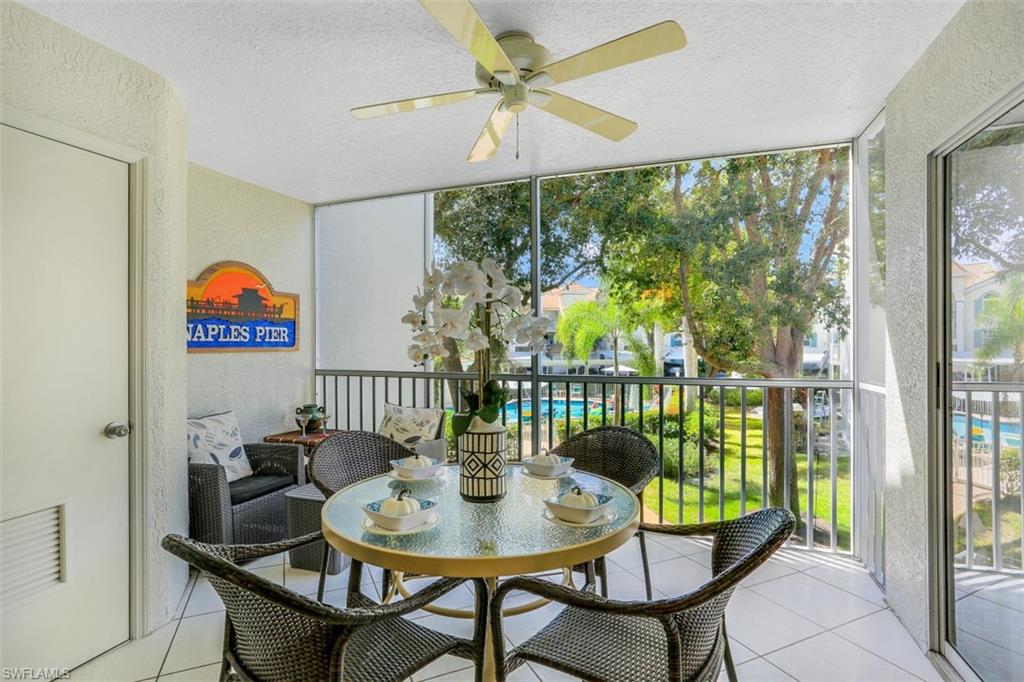 480 Bermuda Cove Way, Unit 1205 Naples, FL 34110 - Photo 24 of 33 a view of a dining room with furniture window and outside view
