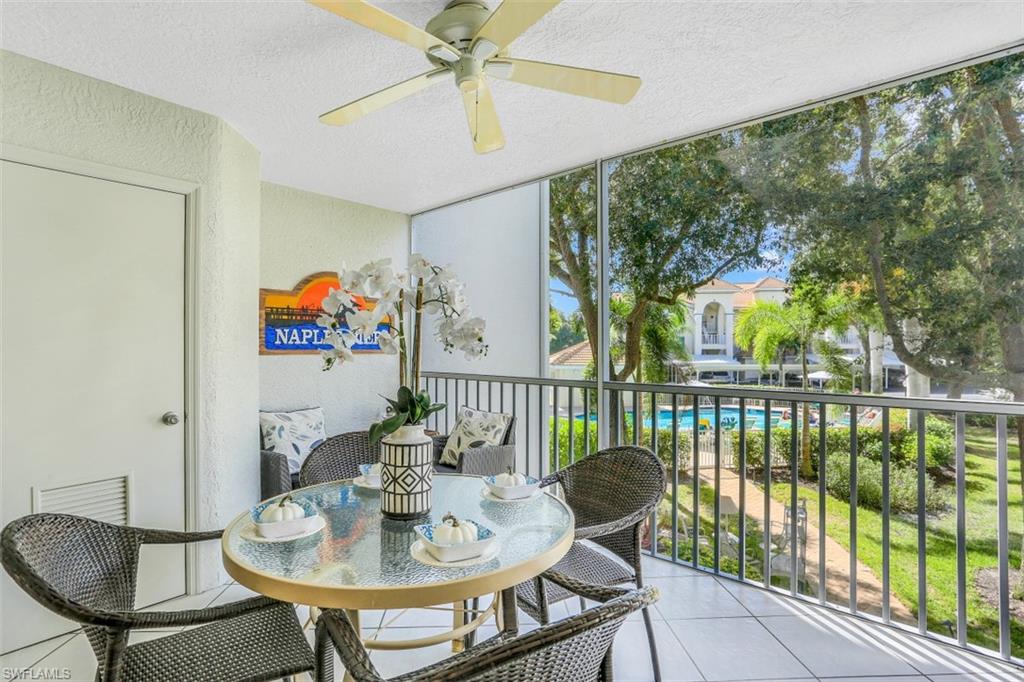 480 Bermuda Cove Way, Unit 1205 Naples, FL 34110 - Photo 25 of 33 a view of a dining room with furniture window and outside view