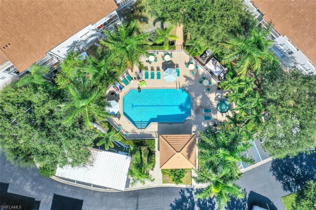 480 Bermuda Cove Way, Unit 1205 Naples, FL 34110 - Photo 32 of 33 an aerial view of a house with a yard and garden