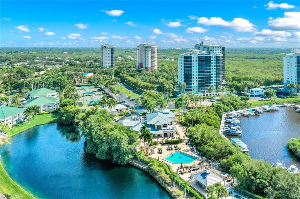480 Bermuda Cove Way, Unit 1205 Naples, FL 34110 - Photo 33 of 33 a view of a city with tall buildings in the background