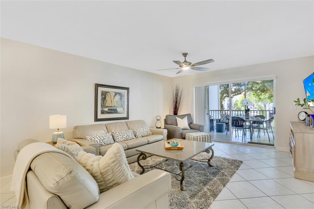 480 Bermuda Cove Way, Unit 1205 Naples, FL 34110 - Photo 7 of 33 a living room with furniture and window